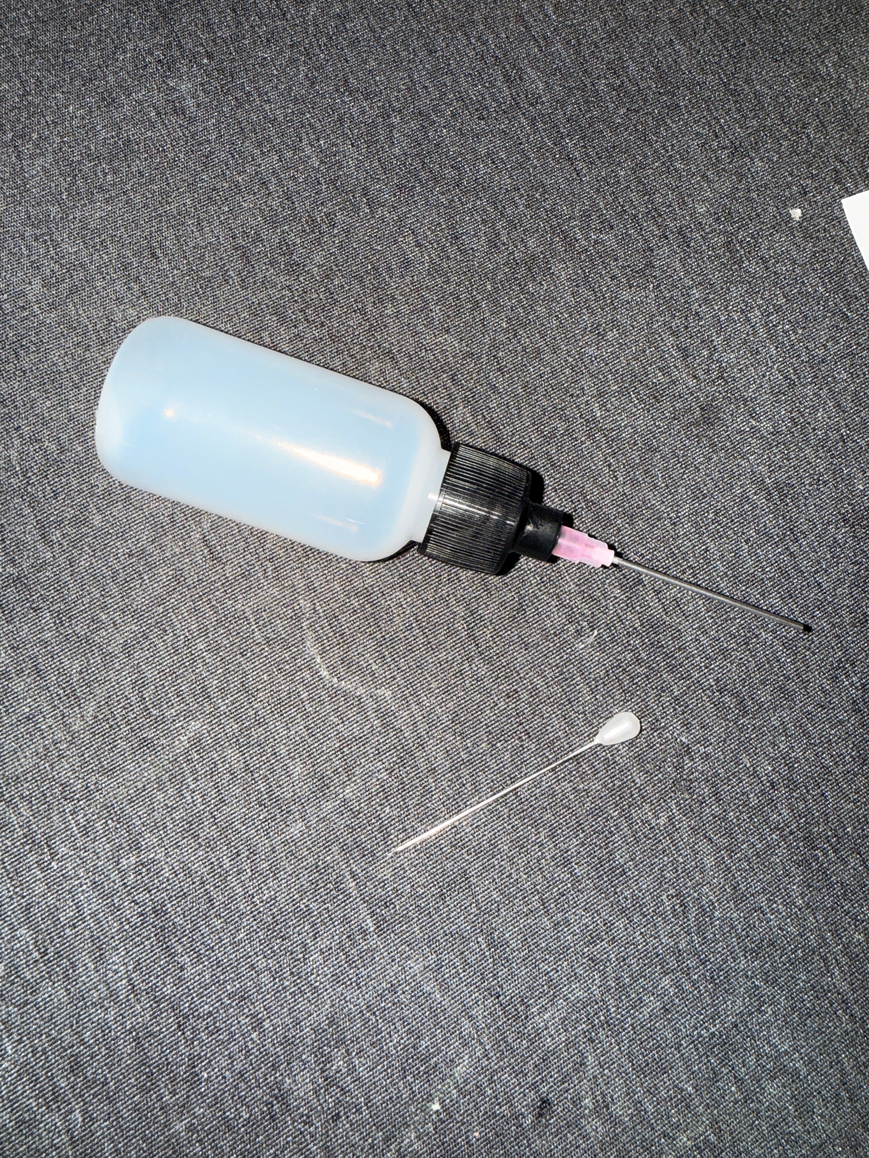 Glue bottle with needle and pin